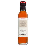 Eine 250-ml-Flasche Gardeny Weißweinessig aus Moscatel mit einer orangefarbenen Flüssigkeit und einem weißen Etikett.