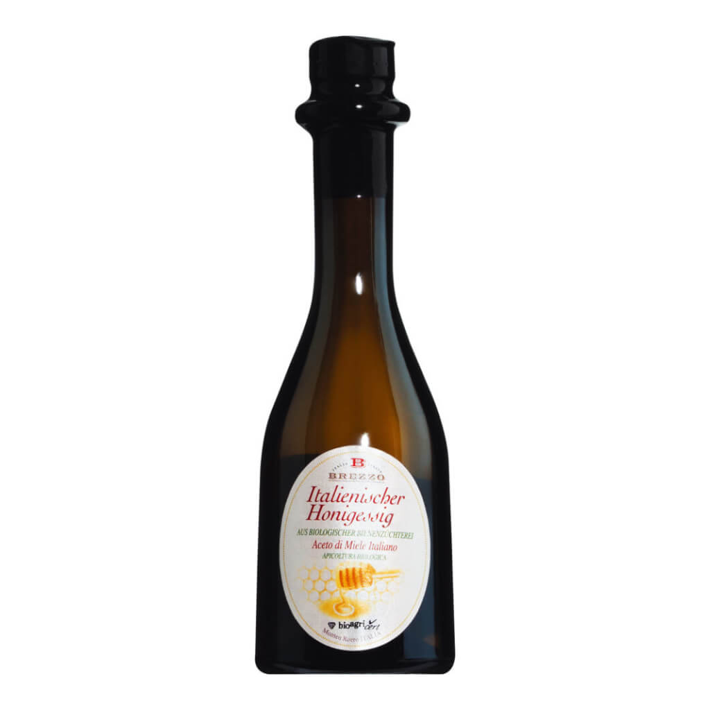 Eine 250-ml-Braunglasflasche Apicoltura Brezzo Honigessig Bio mit 5% Säure, mit einem Etikett mit Wabenmotiv.