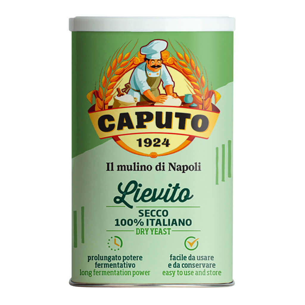 Eine grüne Dose Caputo Trockenhefe, 100 g, mit einer Abbildung eines Bäckers und italienischem Text auf dem Etikett.