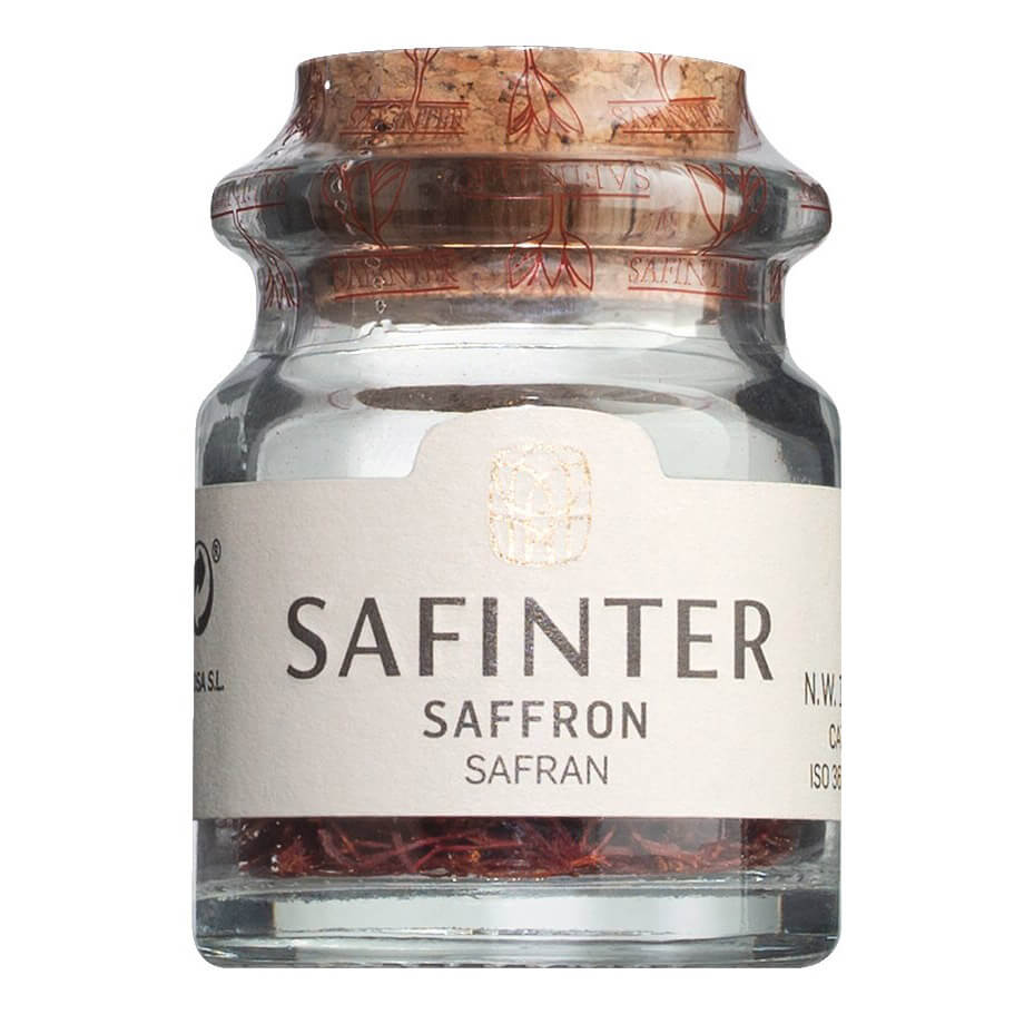 Ein 1g-Glas von Edle Safranfäden von Safinter S.A. mit einem Korkdeckel und weißem Etikett.
