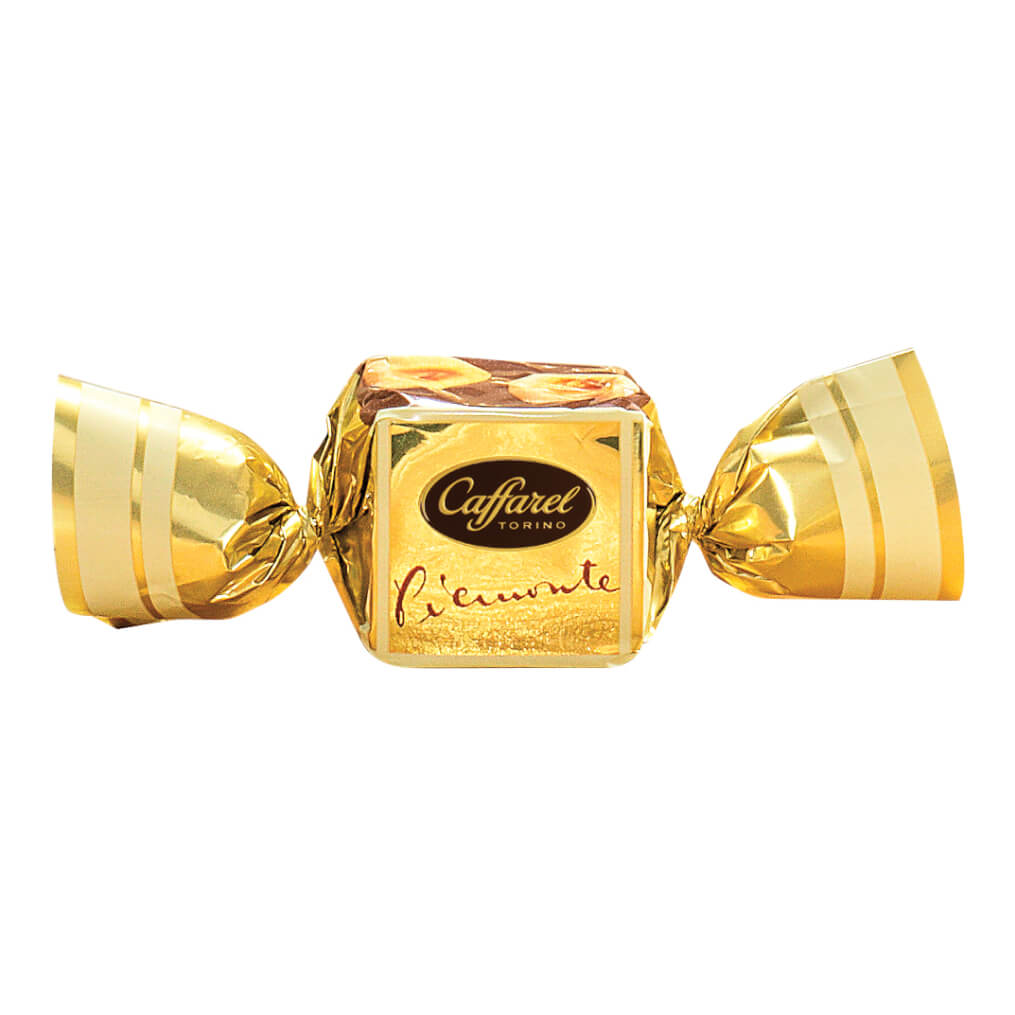Ein in Gold verpackter Caffarel S.p.A. Vollmilch Gianduia-Würfel mit piemontesischen Haselnüssen, 100g.