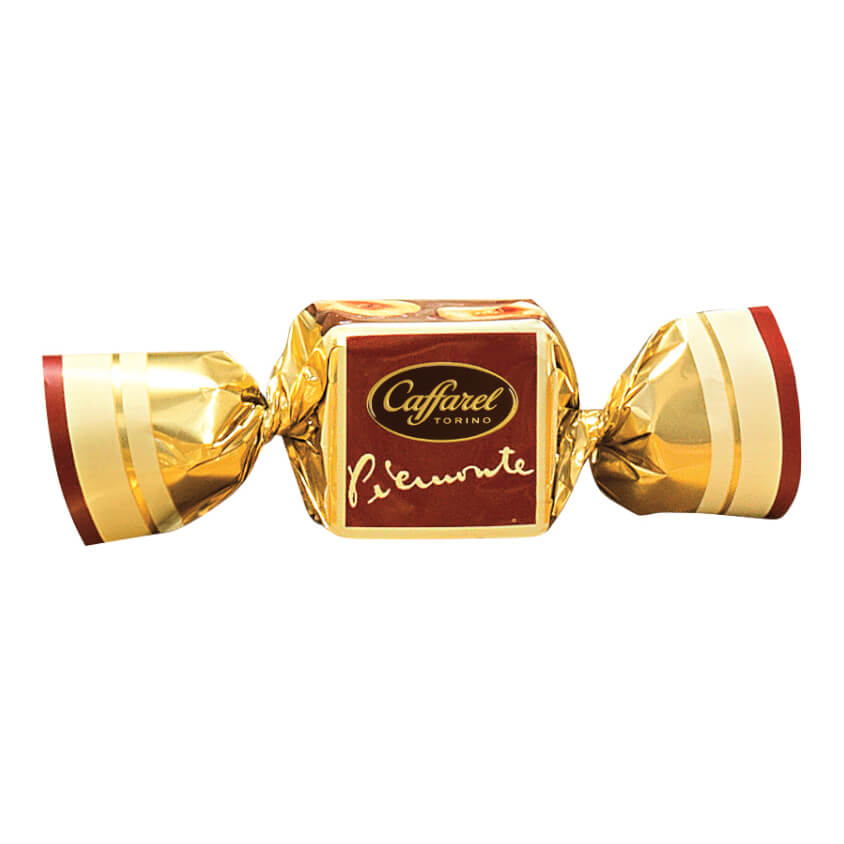 A Caffarel Zartbitter Gianduia-Würfel mit Piemont-Haselnüssen (100g) von Caffarel S.p.A., dekoriert mit goldener Folie sowie roten und weißen Akzenten.