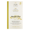 Dolfin Schokolade Vollmilchschokolade mit Masala Chai, 70 g, mit botanischen Illustrationen auf weiß-goldener Verpackung.