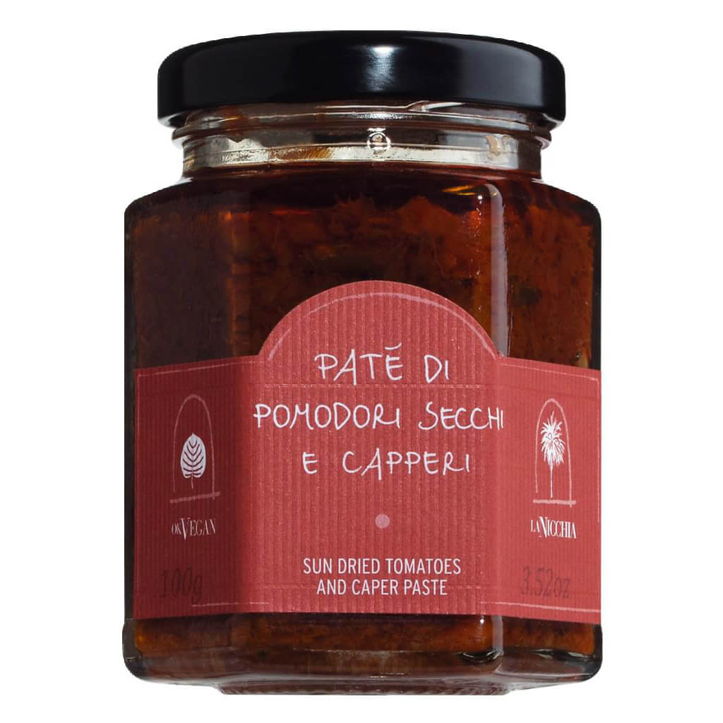 Ein 100-g-Glas Pate di Pomodori Secchi e Capperi - Pesto mit Tomaten & Kapern von La Nicchia, das als Pesto mit sonnengetrockneten Tomaten und Kapern gekennzeichnet ist.