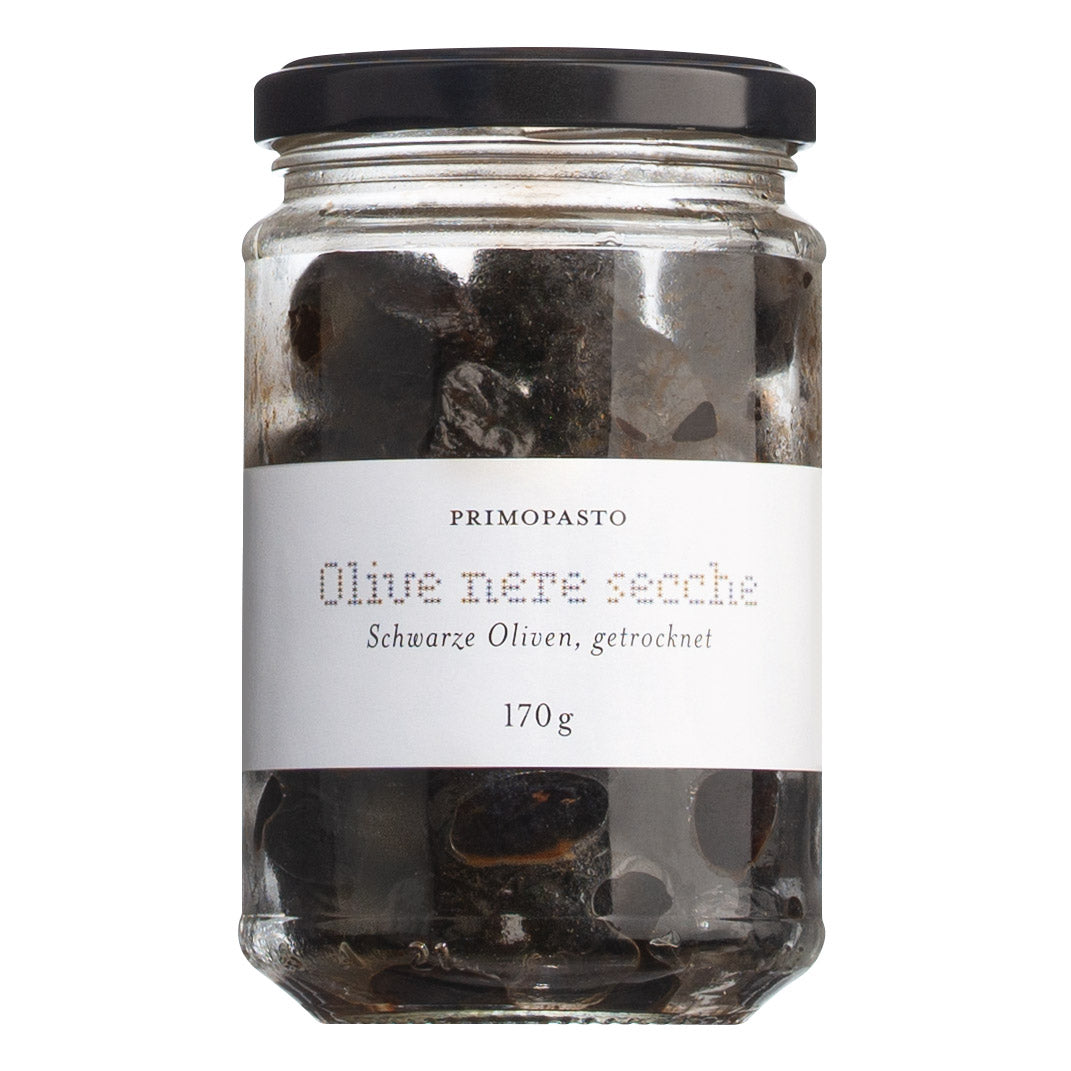 Ein Glas mit 170 g Primopasto Olive nere secche, getrocknete schwarze Oliven, mit weißem Etikett und schwarzem Deckel.