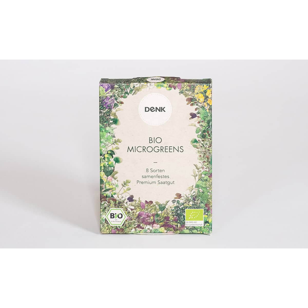 Das 8er Bio Microgreens Samen-Set von Denk by Denk Keramik zeichnet sich durch eine florale Bordüre und Bio-Siegel auf weißem Hintergrund aus.