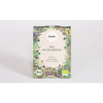 Das 8er Bio Microgreens Samen-Set von Denk by Denk Keramik zeichnet sich durch eine florale Bordüre und Bio-Siegel auf weißem Hintergrund aus.