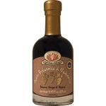 Eine 250-ml-Flasche Aceto balsamico di Modena I.G.P Oro von Rustichella d'Abruzzo S.p.A., mit goldenem Verschluss.