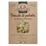 Eine 500-g-Schachtel Gnocchi di Patate von Rustichella by Rustichella d'Abruzzo S.p.A. mit einem Fenster, in dem die Gnocchi zu sehen sind.