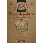 Eine 500-g-Schachtel Rustichella d'Abruzzo S.p.A. Perle di Patate kleine Gnocchi, die durch ein Klarsichtfenster auf der Vorderseite sichtbar ist.