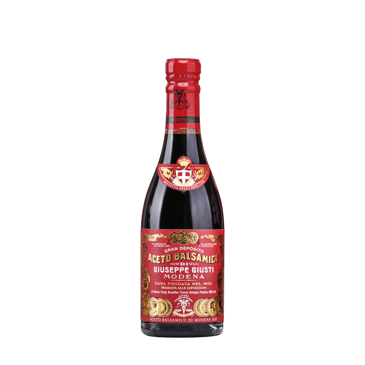 Eine 250-ml-Flasche Giuseppe Giusti Aceto balsamico d'Oro Riccardo Giusti mit 3 Medaillen steht aufrecht, mit dem charakteristischen roten Etikett und Verschluss.