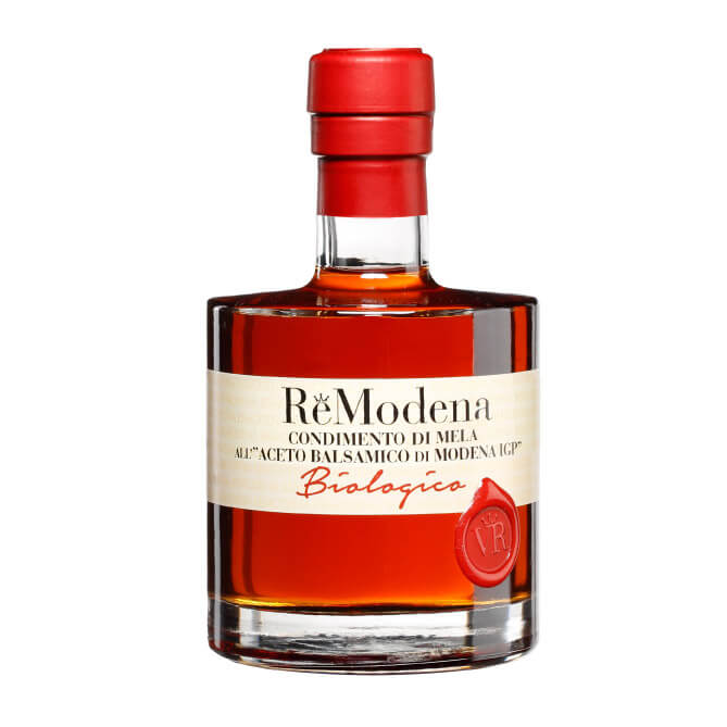 Remodena Apfelbalsamico aus Modena IGP Bio in einer 250-ml-Glasflasche mit rotem Wachssiegel und rotem Verschluss.