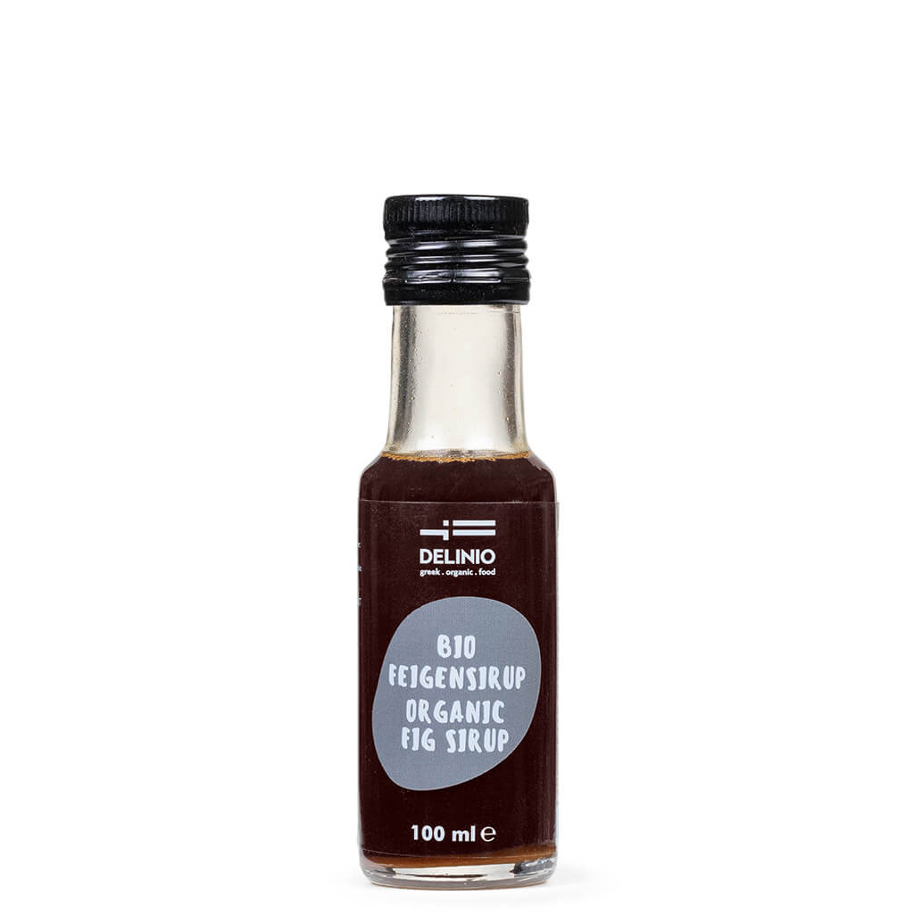 Eine 100 ml Glasflasche DELINIO Feigensirup Bio aus Griechenland mit einem schwarzen Schraubverschluss.